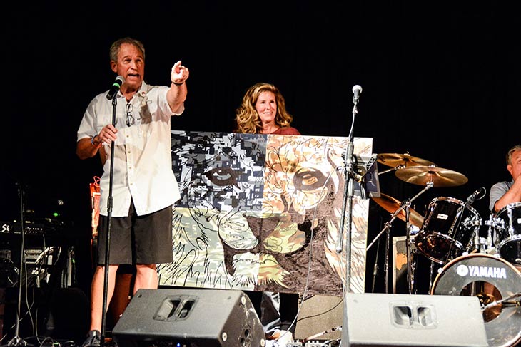Photo of a man speaking on stage at the Hope For The Warriors 2021