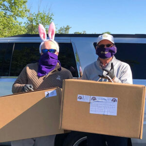 Photo of community members with boxes