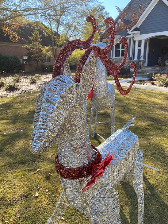 Photo of reindeer decorations in front yard of home
