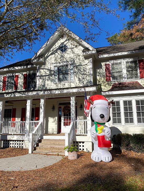Photo of Snoopy Christmas decorations on front porch of home